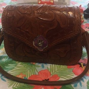 Small tooled leather western bag